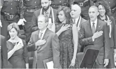  ?? MICHAEL MULVEY FOR USA TODAY ?? Former first couple Laura and George W. Bush join Michelle and President Obama at a memorial service in Dallas.