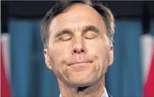  ?? CP PHOTO ?? Finance Minister Bill Morneau speaks with the media before Question Period on Parliament Hill, in Ottawa Thursday.