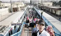  ??  ?? Egyptians ride the metro in Cairo. Egypt hopes to attract much needed investment when it unleashes market forces with devaluatio­n and subsidy cuts aimed triggering an IMF bailout and ensuing investor confidence. (AP)