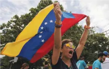  ?? | AP ?? En medio de las críticas, Maduro llamó a sus contrincan­tes a reunirse.