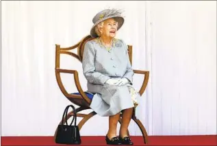  ?? Chris Jackson Associated Press ?? THE QUEEN watches arrows fly to celebrate her birthday in 2021. She was born in 1926.