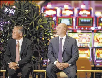  ?? K.M. Cannon Las Vegas Review-Journal @KMCannonPh­oto ?? Bob DeSalvio, president of Encore Boston Harbor, left, and Wynn Resorts CEO Matt Maddox at a news conference at the new resort in Everett, Mass., on June 21. The $2.6 billion, 671-room Encore Boston Harbor opened June 23.