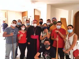  ??  ?? Mgr Joseph Spiteri with young volunteers in Beirut