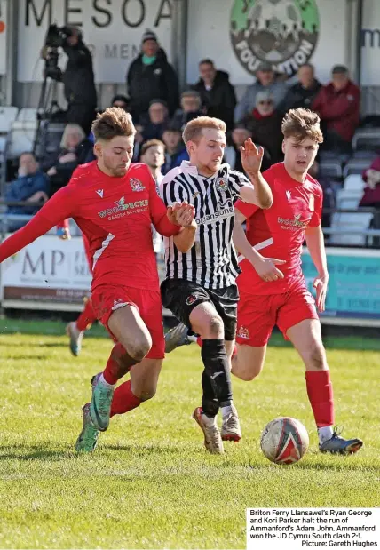  ?? ?? Briton Ferry Llansawel’s Ryan George and Kori Parker halt the run of Ammanford’s Adam John. Ammanford won the JD Cymru South clash 2-1.
Picture: Gareth Hughes