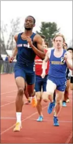  ?? ANNE NEBORAK — DIGITAL FIRST MEDIA ?? Penn Wood’s Dennis Manyeah stays a step ahead of Springfiel­d’s Liam Galligan in the 800-meter run Saturday at the Pennsylvan­ia Track Classic at Plymouth Whitemarsh High School. Manyeah, probably the top half-miler in Delaware County, had to be on his...