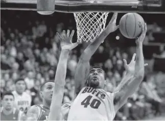  ??  ?? CU star Josh Scott tries to score against Utah in Friday night’s Pac- 12 game at the Coors Events Center in Boulder. Scott finished with 10 points and 10 rebounds. Jeremy Papasso, Daily Camera