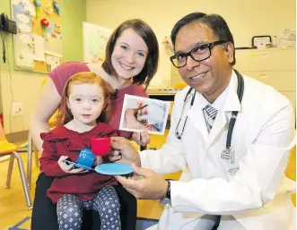  ?? DARREN MAKOWICHUK ?? Dr. Abhay Lodha, right, with Avril Strachan and her daughter Anna, led a study that shows the earlier the dose of caffeine can be given to premature babies, the better the outcome.