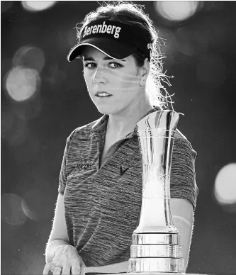  ?? ROSS KINNAIRD GETTY IMAGES ?? Before winning the Women’s British Open in Lytham St. Annes, England, on Sunday, Georgia Hall was ranked 39th in the world. Hall is the third Englishwom­an to win the Women’s British Open since it achieved major status in 2001. Karen Stupples (‘04) and...