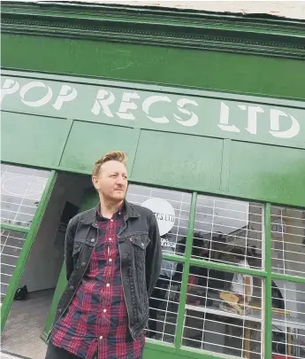  ??  ?? Dave Harper outside Pop Recs in High Street West.