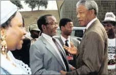  ??  ?? Oliver Tambo, centre, in 1991 with Nelson Mandela and Adelaide Tambo.