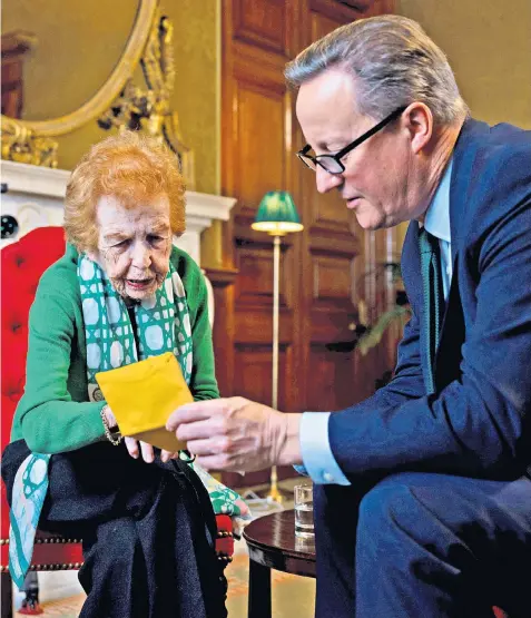  ?? ?? Lord Cameron, the Foreign Secretary, speaks with Eve Kugler, a Holocaust survivor, in London ahead of a trip to Israel, where he is expected to push for a pause in fighting
