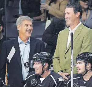  ?? CP PHOTO ?? In the latest edition of NHL 100, a weekly series from The Canadian Press, we look at some of the players who left the game too soon or were never able to reach their full potential. Team Lemieux coaches Bobby Orr, left, and Mario Lemieux laugh during...