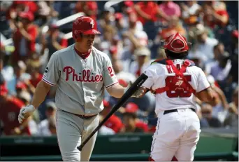  ?? PATRICK SEMANSKY — THE ASSOCIATED PRESS ?? Phillies’ Jay Bruce walks off the field after striking out looking to end the fourth inning in the first game of Tuesday’s doublehead­er against the Nationals in Washington.