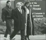  ?? HAMILTON SPECTATOR FILE PHOTO ?? Mob boss Dominic Musitano, centre, leaves the Milton courthouse in 1991.