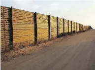  ??  ?? “A NATION WITHOUT BORDERS IS NOT A NATION” BORDER WALL