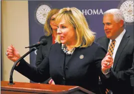  ??  ?? The Associated Press file Oklahoma Gov. Mary Fallin speaks during a news conference following a vote on a package of tax hikes to fund teacher pay raises in Oklahoma City. Fallin says teachers striking for more funding are like “a teenage kid that...