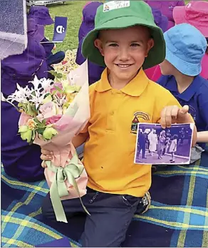  ??  ?? Finn at Victoria Park last Wednesday, October 17, with flowers and a photo for the royal couple.