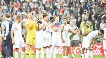  ??  ?? England were given a rousing ovation by their fans despite defeat to Croatia. - AFP photo