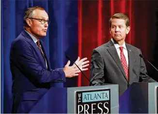  ?? CURTIS COMPTON / CCOMPTON@AJC.COM ?? Lt. Gov. Casey Cagle (left) and Secretary of State Brian Kemp — the Republican candidates for governor — face off Thursday in a debate sponsored by the Atlanta Press Club.