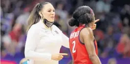  ?? CARMEN MANDATO/GETTY ?? Arizona coach Adia Barnes led her alma mater to its first NCAA Tournament since 2005, first Sweet 16 since she was a player in 1998 and a runner-up finish.