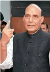  ?? PTI ?? Rajnath Singh showing his marked finger at a polling station in Sunday. —