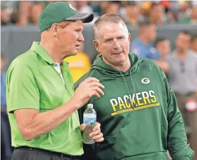  ?? MARK HOFFMAN / MILWAUKEE JOURNAL SENTINEL ?? Packers President Mark Murphy (left) talks with vice president of football administra­tion/player finance Russ Ball last season.