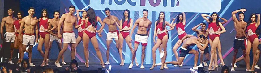  ??  ?? Red alert: The 26 Century Tuna Superbods Nation 2016 finalists in their red-hot opening number, setting temperatur­es high at the exclusive Palace Pool Club.