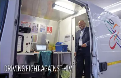  ?? Picture: Tracy Lee Stark ?? Dr Clement Ngcuka stands in one of the mobile testing trucks for a new model of community-based testand-treat services in the fight against HIV in South Africa. The approach sees a move from mobile tents to customised vehicles. The truck can process...