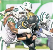  ?? Getty Images; USA TODAY Sports ?? TAKING IT PERSONAL: Despite their reputation, the Jets’ defensive corps has struggled against the run. Leonard Fournette (top, left) and the Jaguars ran for 175 yards against Darron Lee (top, right) and the Jets. Leonard Williams (above, tackling Blake...