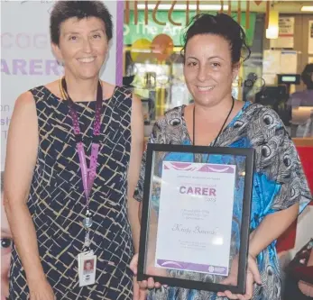  ??  ?? Department CEO Anne Bradford with foster carer Kristy Bazevski at the Nhulunbuy 2015 Foster and Kinship Carer Excellence Awards ceremony