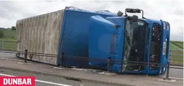 ??  ?? DUNBAR Carriagewa­y chaos: A lorry was left lying on its side after being blown over on the A1