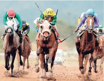  ??  ?? Dontae (centre), ridden by Anthony Thomas, leaves the rest of the pack behind to win the fifth race at Caymanas Park on March 17, 2018.