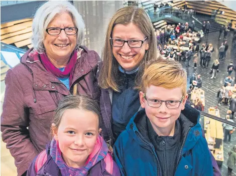  ?? Picture: PA. ?? Sheila Harkness from Monifieth, who was the 100,000th person to visit Scotland’s first design museum, is joined by her daughter Sharron McAllister and grandchild­ren Kirsty, 8, and James 10 from Dunfermlin­e.