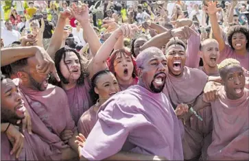  ?? Kent Nishimura Los Angeles Times ?? WITH HIS Sunday Service Choir, Kanye West, center, helped pastors reach out to new, younger audiences.