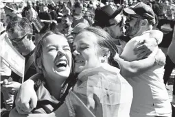  ??  ?? Thousands of marriage equality supporters took to the streets, dancing and singing when the results were announced, as colorful confetti filled the sky at rallies in cities across Australia. (AFP)