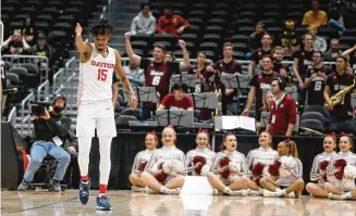  ?? DAVID JABLONSKI / STAFF / FILE ?? In a game against Massachuse­tts last year, Dayton’s Daron Holmes II celebrates after a defensive stop in the Atlantic 10 Conference quarterfin­als March 11, 2022, at Capital One Arena in Washington, D.C. So far this season, the A-10’s conference games have been unpredicta­ble.