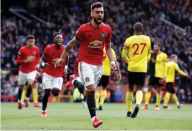  ??  ?? Manchester United’s Bruno Fernandes celebrates scoring the opening goal. Photograph: Martin Rickett/PA