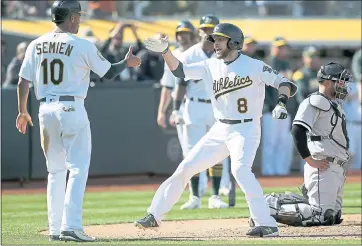  ?? JANE TYSKA — STAFF PHOTOGRAPH­ER ?? Jed Lowrie (8) set an Oakland record last year with 49 doubles. The mark ranks second in the franchise’s overall history.