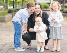  ?? ALANA COUCH • POSTMEDIA ?? Andrea Firmani, St. Paul’s Hospital nurse clinician and breastfeed­ing expert, with her three children: From left, Ben, Lizzie and Josie.