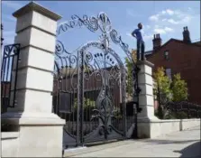  ?? KENNY CONDRA — ROBERT THOMAS VIA AP ?? This undated photo shows Robert Thomas standing next to a completed gate commission for a historic property in Pittsburgh, Pa.