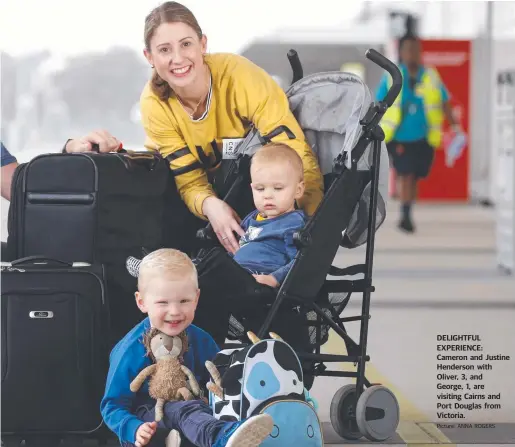  ??  ?? DELIGHTFUL EXPERIENCE: Cameron and Justine Henderson with Oliver, 3, and George, 1, are visiting Cairns and Port Douglas from Victoria. Picture: ANNA ROGERS