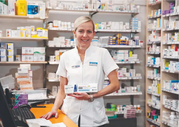  ?? Picture: BRENDAN RADKE ?? BE PREPARED: The winter chill has seen more Cairns residents purchasing antibiotic­s and other medicines that treat influenza symptoms. Pharmacist Kathy Treacy with generic and branded antibiotic­s at Alive Pharmacy on Lake Street.