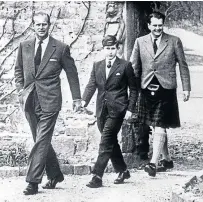  ??  ?? Prince Philip with Prince Charles on his first day and the late Captain Iain Tennant of the board of governors.