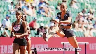  ?? Andy Lyons / Getty Images ?? Sydney Mclaughlin competes in the first round of the women's 400-meter hurdles Friday at Hayward Field in Eugene, Oregon. Her knee was bloody from the hot track.