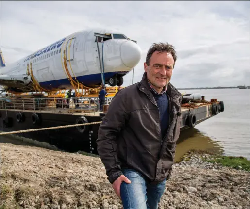  ??  ?? David McGowan pictured beside the Boeing 767 which he managed to get to Enniscrone from Shannon by road and sea for his Quirky Nights Glamping village which he hopes to open next summer provided he can get funding in place.
