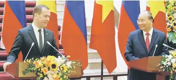  ??  ?? Russia’s Prime Minister Dmitri Medvedev attends a news conference with hisVietnam­ese counterpar­t Nguyen Xuan Phuc at the Government Office in Hanoi, Vietnam. — Reuters photo