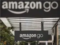  ?? GETTY IMAGES FILE PHOTO ?? Amazon is testing out checkout-less grocery stores at its Amazon Go store in Seattle. Payments are made via smartphone­s.