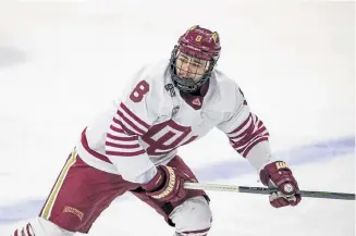  ?? John Peterson, The Associated Press ?? Denver freshman forward Carter Savoie ( 8) already has five points through three games with the Pioneers this season.