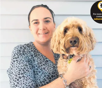  ??  ?? Tania Schrey, pictured with cocker spanielpoo­dle cross Mia, says having Pet Depot designated an essential service has been a huge boost. Right: Pet Depot’s Hobsonvill­e Point warehouse. nzherald.co.nz