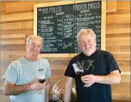  ?? Patrick Mullen/The Signal ?? Doug Millick, co-owner of Hoi Polloi Winery, left, and Scott Page-Pagter, co-owner of Pagter Brothers Winery, at the Double Trouble Tasting Room on Main Street in Newhall, which features wines from both wineries.